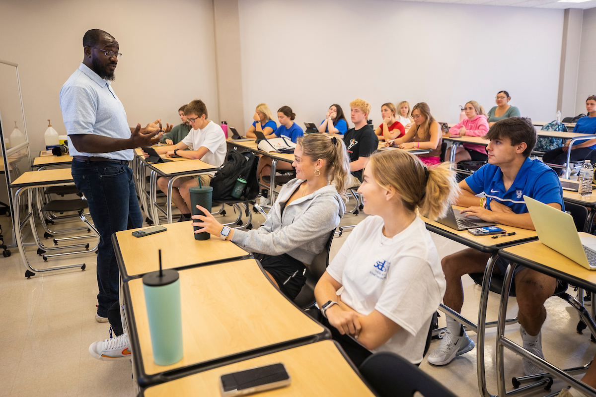 Professor leading class in the College of Communication and Information