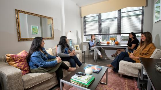 Female students hanging out in residence hall suite