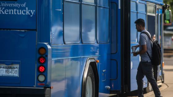 Student boarding the UK bus