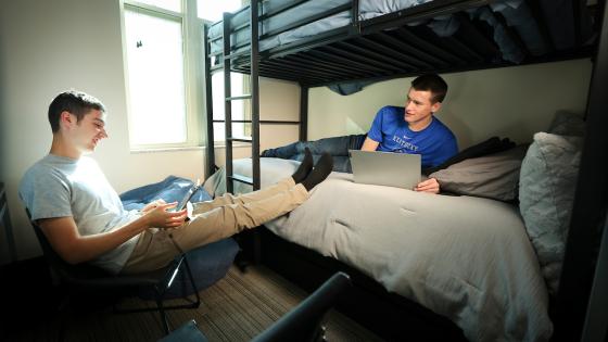 Two male roommates in a dorm room