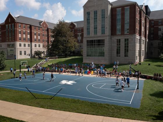 Students playing basketball in Woodland Glen courtyard